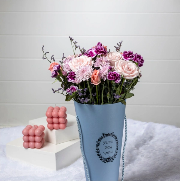 Unwrap a Blush Surprise: Our floral box arrangement overflows with a touch of elegant pink