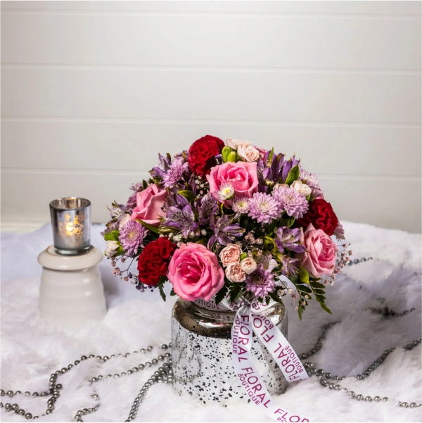 Silver Symphony: A breathtaking mix of pink and purple in a sleek silver vase